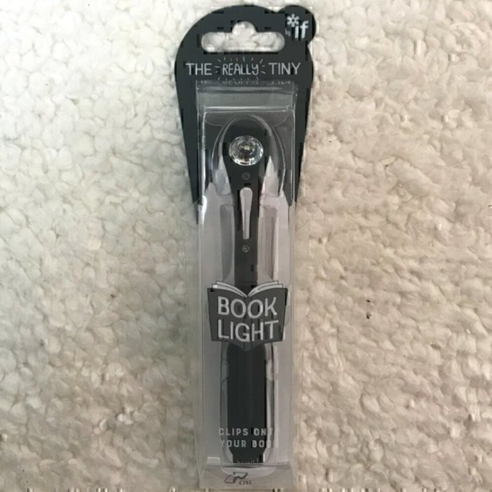 The "Really Tiny" Battery Operated Travel Booklight That Clips onto Your Book
